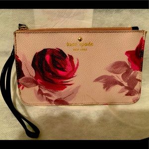 Kate spade wristlet pink and roses.